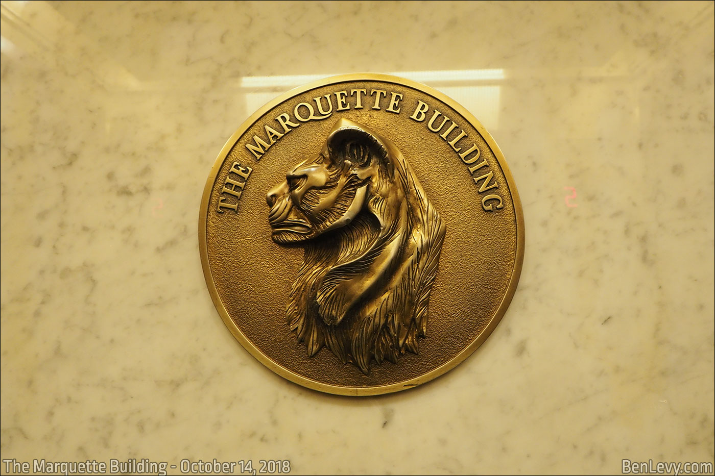 Bronze relief of a pather at The Marquette Building